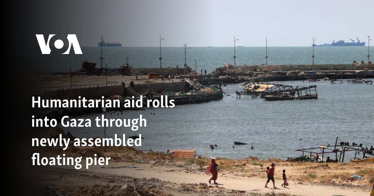 Humanitarian aid rolls into Gaza through newly assembled floating pier