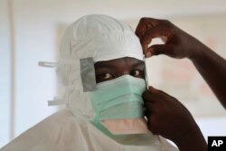 A nurse gears up to enter a high-risk zone of an Ebola treatment unit run by Doctors Without Borders in Liberia on Sept. 29, 2014.