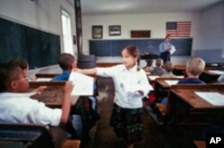 There's only one thing wrong with this old-fashioned one-room schoolroom at the Ag Hall of Fame: The U.S. flag has 50 stars!