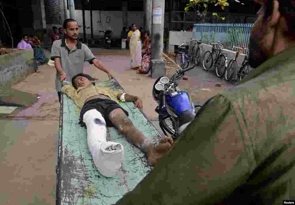 An injured boy is taken to a hospital after an earthquake struck Nepal and other countries in the region, Siliguri, India, April 25, 2015.