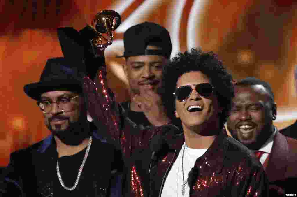 Bruno Mars accepts the Grammy for album of the year for &quot;24K Magic&quot; during the 60th Annual Grammy Awards show in New York, Jan. 28, 2018.