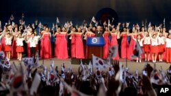FILE - Participants give three cheers during a ceremony to mark the South Korean Liberation Day from Japanese colonial rule in 1945 in Seoul, South Korea, Aug. 15, 2013.