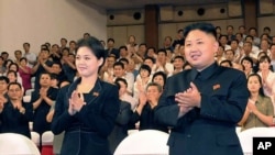 Photo released on July 9, 2012 shows North Korean leader Kim Jong Un and Ri Sol Ju during a musical performance in Pyongyang. (KCNA)
