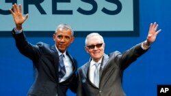 FILE - President Barack Obama, left, and Senate Minority Leader Sen. Harry Reid wave onstage at the National Clean Energy Summit, Aug. 24, 2015, in Las Vegas.