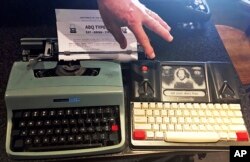 A 1964 Olivetti Lettera 32 and a Freewrite — a modern, smart typewriter that sends typed documents to the cloud — are on display at a "type-in" in Albuquerque, N.M., April 23, 2017.
