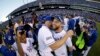 Kansas City Royals' Alex Gordon, right, celebrates with teammates after the Royals defeated the Baltimore Orioles to win the American League baseball championship series Wednesday, Oct. 15, 2014.
