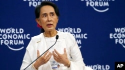 Aung San Suu Kyi, the State Counsellor of Myanmar, gestures during a one-on-one discussion with Berge Brende at the World Economic Forum's meeting at the National Convention Center, Sept. 13, 2018 in Hanoi, Vietnam. Suu Kyi said the country's handling of its Rohingya Muslim minority crisis could have been better. 