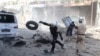 Civil defense members look for survivors after an airstrike on the rebel-held Old Aleppo, Syria, April 16, 2016. 