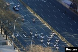 A vehicle that is part of a motorcade believed to be carrying North Korean leader Kim Jong Un makes its way through central Beijing, China, Jan. 8, 2019.