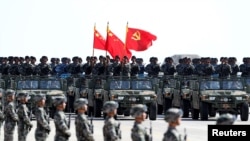 Soldiers of China's People's Liberation Army (PLA) march during a military parade to commemorate the 90th anniversary of the foundation of the army at the Zhurihe military training base in Inner Mongolia Autonomous Region, China, July 30, 2017. 