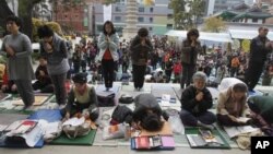 South Korean parents pray during a special service to wish for their children's success on the College Scholastic Ability Test