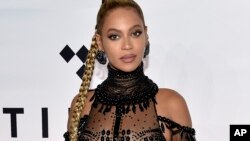 FILE - In this Oct. 15, 2016 file photo, singer Beyonce Knowles attends the Tidal X: 1015 benefit concert in New York. Beyonce says she’s working with her charity to assist those in her hometown affected by Tropical Storm Harvey.