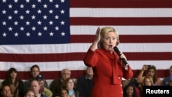 FILE - Democratic presidential candidate Hillary Clinton speaks at a campaign rally in Las Vegas, Nevada, Feb. 14, 2016. The judge's order gives Judicial Watch and the State Department until April 12 to come up with a plan for moving forward with the depositions. 