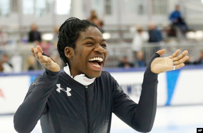 Maame Biney reacts during a medal ceremony after winning the women's 500-meter race during the U.S. Olympic short track speedskating trials, Dec. 16, 2017, in Kearns, Utah.