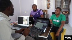 A team of young Nigerians working for WeSabi talk about how to improve services. WeSabi is a new tech startup that helps people connect to trade laborers like carpenters or painters. (C. Oduah for VOA)