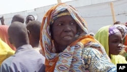 FILE - An old woman, who fled her home due to violence from the Islamic extremists group Boko Haram, is seen inside a refugee camp in Minawao, Cameroon, Feb. 25, 2015. 