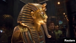 The mask of King Tutankhamun, which was found to have been damaged and glued back together, is seen at the Egyptian Museum in Cairo, Jan. 24, 2015. 