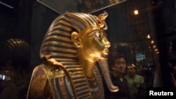 The mask of King Tutankhamun, which was found to have been damaged and glued back together, is seen at the Egyptian Museum in Cairo, Jan. 24, 2015. 