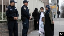 Worshippers arrive for service at the Islamic Cultural Center of New York under increased police security following the shooting in New Zealand, March 15, 2019, in New York. 