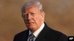 U.S. President Donald Trump walks across the South Lawn of the White House in Washington, March 25, 2018, after returning from his Mar-a-Lago estate in Palm Beach, Florida.