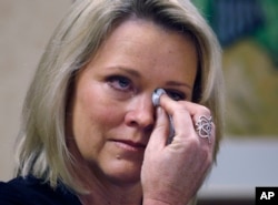 Former Boston television news anchor Heather Unruh wipes tears while speaking Nov. 8, 2017, in Boston about the alleged sexual assault of her teenage son by actor Kevin Spacey in the summer of 2016 on Nantucket.