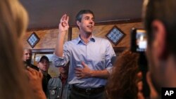 Former Texas congressman Beto O'Rourke addresses a gathering during a campaign stop at a restaurant in Manchester, N.H., March 21, 2019.