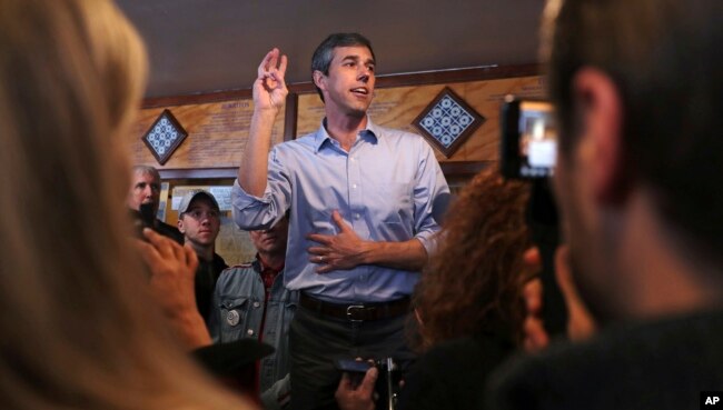 Former Texas congressman Beto O'Rourke addresses a gathering during a campaign stop at a restaurant in Manchester, New Hampshire, March 21, 2019.