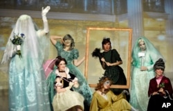 Contestants "The Women of the Haunted Mansion" perform onstage during the 41st Annual Comic-Con Masquerade costume competition in San Diego, California, July 11, 2015.