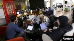 Participants of the "Start Up Chile" program work at their headquarters in Santiago, Aug. 10, 2015. 