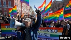 Participants march and shout slogans during a protest by gay rights activists in St. Petersburg May 1, 2013.