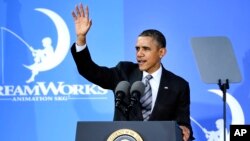 President Barack Obama waves after speaking at the DreamWorks Animation studio, Nov. 26, 2013, in Glendale, California.