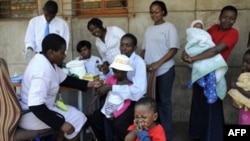 Children getting vaccinations for measles on the streets of Johannesburg, South Africa, October of 2009.