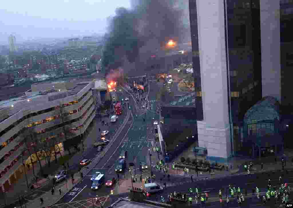 Two people were killed when a helicopter hit a crane at a building site in central London during morning rush hour and plunged to the ground, engulfing several cars in flames. (Vicotry Jimenez)