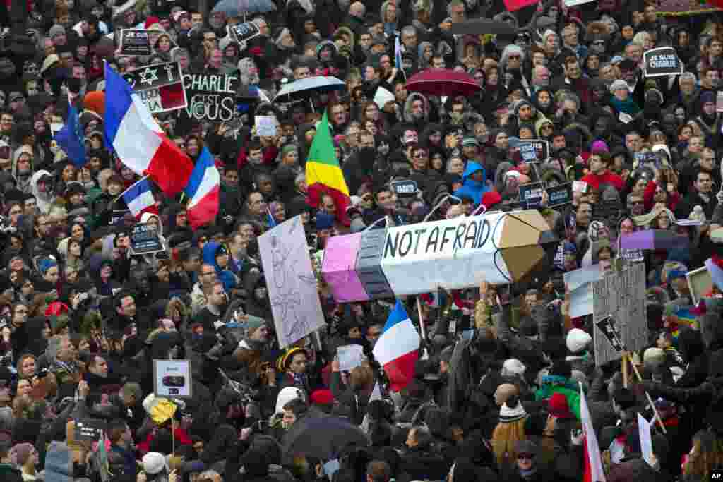 Thousands of people began filling France&rsquo;s iconic Republique Square, Jan. 11, 2015, in a rally of defiance and sorrow to honor the 17 victims of three days of bloodshed that left France on alert for more violence.