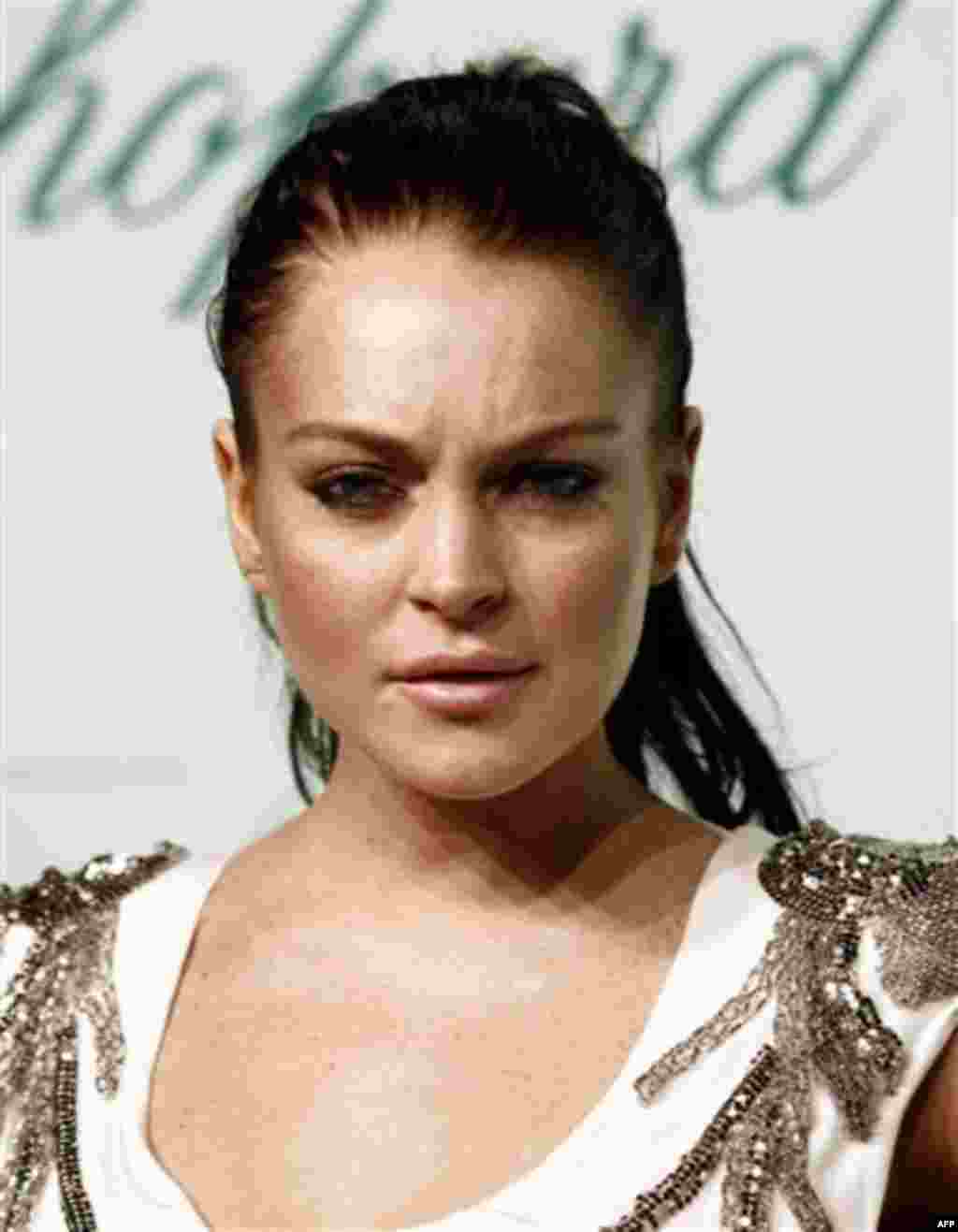 FILE - In this May 17, 2010 file photo, Lindsay Lohan arrives for an event during the 63rd international film festival, in Cannes, France. A judge on Thursday, May 20, 2010 issued a warrant for Lohan's arrest after the actress missed a mandatory hearing. 