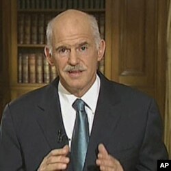 In this image taken from TV, Greek Prime Minister George Papandreou, talks to the nation in a live TV broadcast, June 15, 2011, in Athens