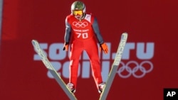 Poland's Kamil Stoch jumps during the men's normal hill ski jumping training at the 2014 Winter Olympics in Krasnaya Polyana, Feb. 7, 2014.