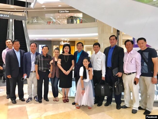 Hun Sen, Cambodia's prime minister, is pictured with his family at a shopping mall.