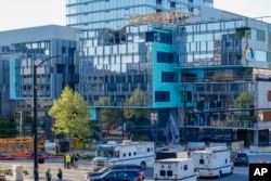 Emergency crews work at the scene of a construction crane collapse where several people were killed and several others injured, April 27, 2019. The crane was being dismantled when it collapsed, witnesses said.