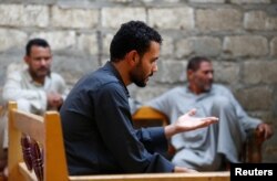 Khalid Abushusha, brother of Ibrahim Abushusha, a 26-year-old man who worked as a day laborer and was one of at least 22 Egyptians found dead earlier this month in the Libyan desert, gestures in the village of Tarfa al-Kom in Minya province, Egypt, July 12, 2017.