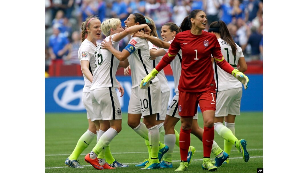 United States' Carli Lloyd (3-L) celebrates with teammates, including goalkeeper Hope Solo (1), after Lloyd scored her third goal against Japan during the first half of the Women's World Cup soccer championship in Vancouver, Canada, July 5, 2015.