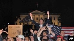 A crowd of mostly young Americans have gathered in front of the White House after President Obama's announcement of the death of Osama bin Laden. Even at 2:00am on Monday, May 02, 2011, they continue to celebrate the news, shouting "U-S-A, U-S-A!"