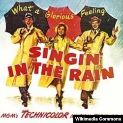 진 켈리가 출연한 1952년에 개봉된 '사랑을 비를 타고 (Singin' in the Rain)'의 포스터.