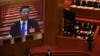 北京人大会堂举行的全国人大年度会议大屏幕上显示中国领导人习近平在出席会议。（2021年3月8日）