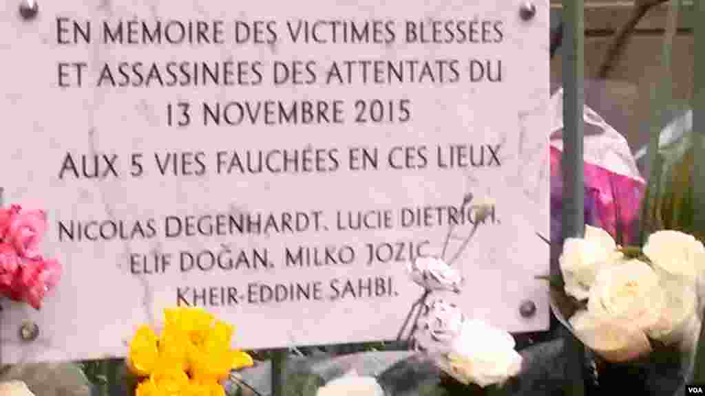 A plaque near Cafe Bonne Biere shows the names of those killed there by jihadists last year, in Paris, Nov. 13, 2016. (L. Bryant/VOA)