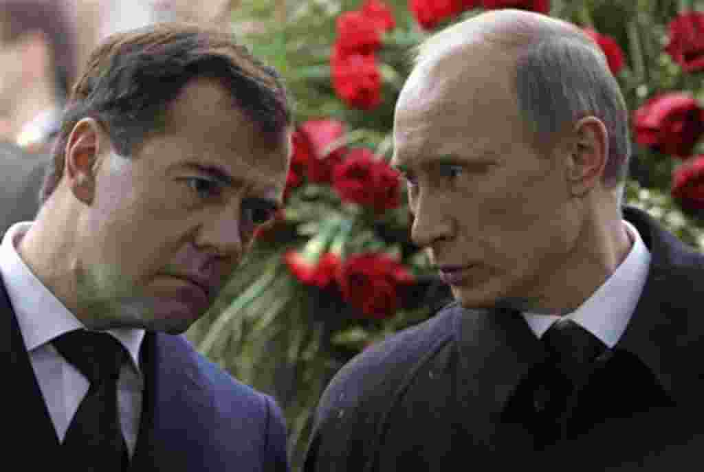 Russian President Dmitry Medvedev, left, and Prime Minister Vladimir Putin attend funeral of former Russian Prime Minister Viktor Chernomyrdin at Novodevichy Cemetery in Moscow, Russia, Friday, Nov. 5, 2010. Viktor Chernomyrdin, who served as Russia's pri