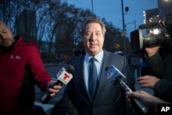 Joaquin Guzman's defense attorney Jeffrey Lichtman, speaks to reporters as he leaves Brooklyn Federal Court after opening arguments in the trial of the Mexican drug lord known as "El Chapo," Nov. 13, 2018, in New York.