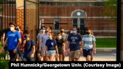 Georgetown University students walk through campus during a summer program in June 2021.