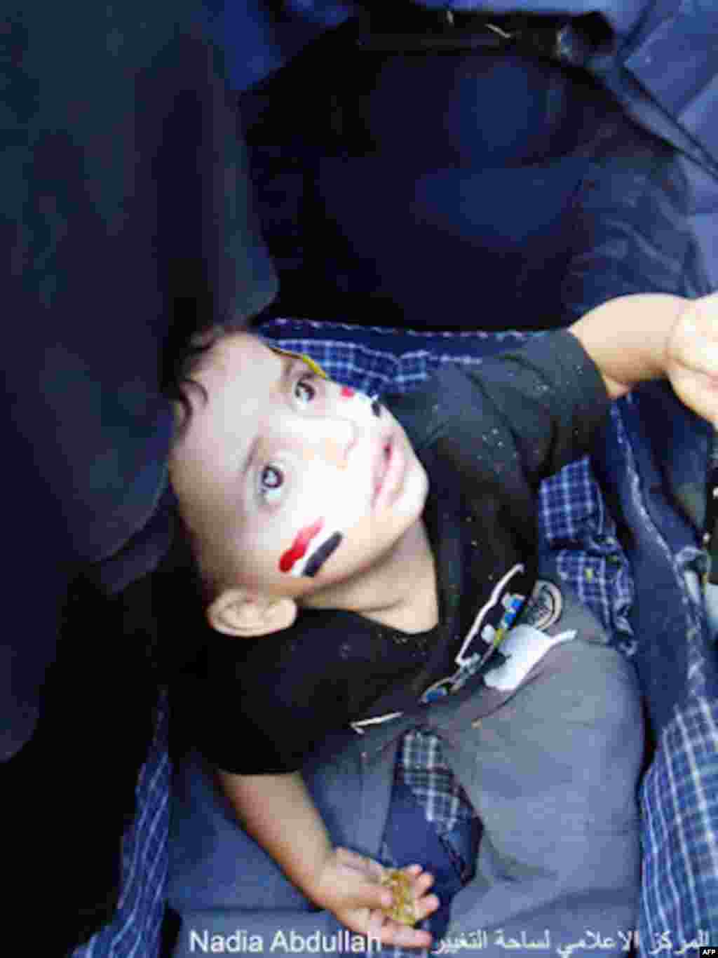 A young child with the Yemen flag painted on his cheeks at a demonstration (Photo - Nadia Abdullah)