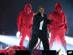 Kendrick Lamar, center, performs at the 60th annual Grammy Awards at Madison Square Garden on Sunday, Jan. 28, 2018, in New York.